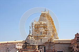 Shiva Virupaksha Temple. Hampi, Karnataka, India. White yellow restored temple against the blue sky. Carving stone