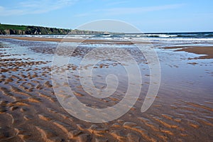 A shoal on the sea coast from which the water receded due to low tide photo