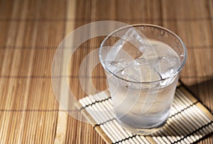 Shochu placed on a Japanese style wooden background