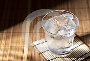 Shochu placed on a Japanese style wooden background