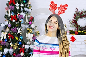 Shock happy excited african american young woman at Christmas tree home background. Happy New Year, Merry Christmas holidays. Gift