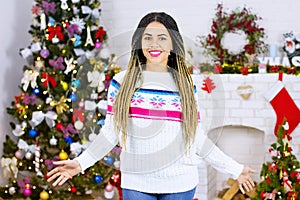 Shock happy excited african american young woman at Christmas tree home background. Happy New Year, Merry Christmas holidays. Gift