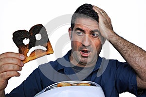 Shock man holds a burnt slice of toast