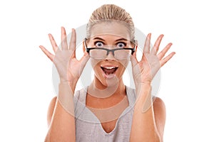 Shock, surprise and portrait of a woman with glasses in a studio with a omg, wow or wtf facial expression. Shocked