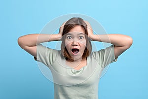 Shock / surprise and wow concept. Portrait of shocked asian woman open mouth being surprised or astonished to see large discounts