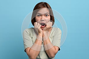 Shock / surprise and wow concept. Portrait of shocked asian woman open mouth being surprised or astonished to see large discounts