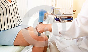 Shock wave therapy. The magnetic field, rehabilitation. Physiotherapist doctor