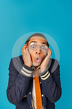 shocked african american student in eyeglasses