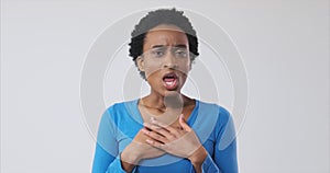 Shocked african american woman over white background