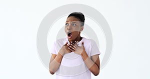 Shocked African American woman over white background