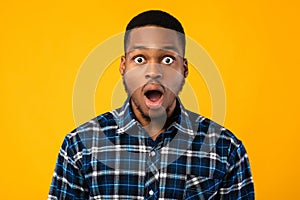 Shocked African Man Looking At Camera In Amazement, Studio Shot