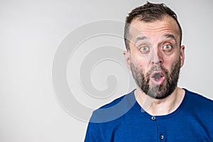 Astonished shocked adult man photo