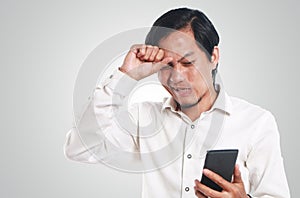 Shocked Asian Man With His Smart Phone