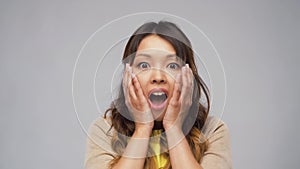 Shocked asian woman with open mouth