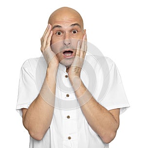 Shocked bald man in white shirt. Isolated