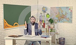 shocked bearded man overworked in school while studying, education