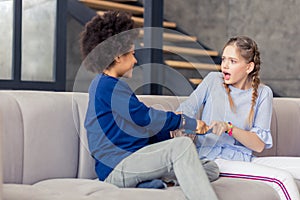 Shocked blonde teenager staring at her friend