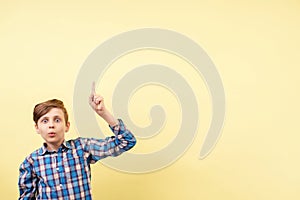 Shocked boy pointing to object or text, template