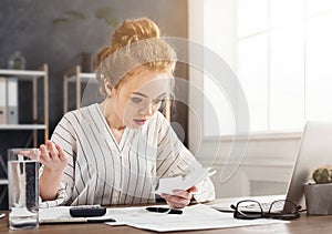 Shocked business woman looking at increasing costs