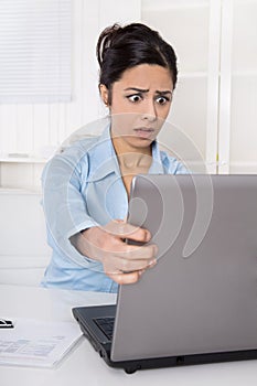 Shocked businesswoman forgotten her password or is victim of com