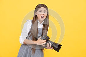 shocked child girl take photo with digicam, photography