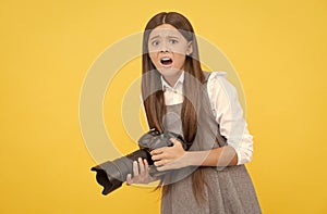 shocked child girl take photo with digicam, photography