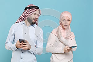 Shocked concerned couple friends arabian muslim man wonam in keffiyeh kafiya ring igal agal hijab clothes isolated on