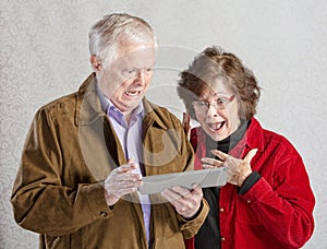 Shocked Couple with Tablet