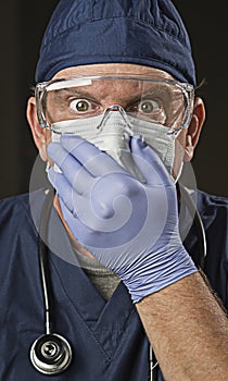 Shocked Doctor or Nurse with Protective Wear and Stethoscope