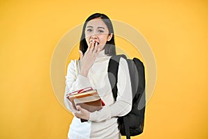 A shocked and excited Asian female college student is covering her mouth, showing a surprise face