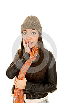 Shocked expression on female model's face wearing a beanie