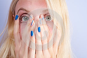 Shocked face of young woman. Funny female shocked face expression. Unbelievable. Portrait of excited woman spreading