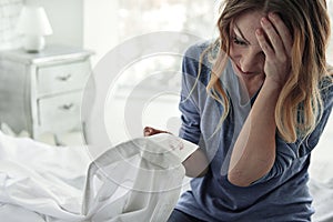 Shocked female person keeping shirt