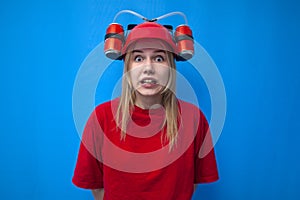 Shocked funny girl fan in red uniform and beer hat is rooting for her team, cheerleader in stress