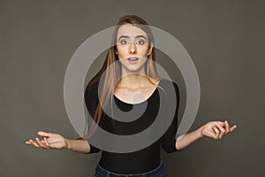 Shocked girl with arms up in air in full disbelief