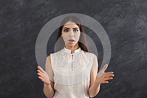 Shocked girl with arms up in air in full disbelief