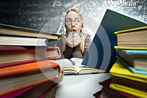 Shocked girl looking in open book