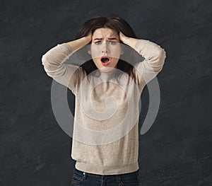 Shocked girl with opened mouth in full disbelief