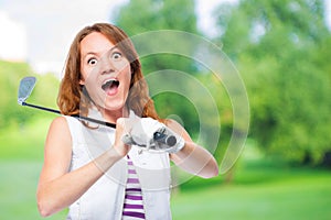 Shocked golfer looking behind the trajectory of a ball flying