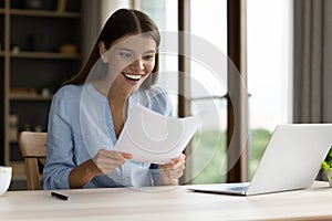 Shocked happy student girl receiving admission letter from university