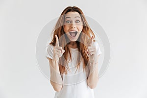 Shocked happy woman in t-shirt having idea