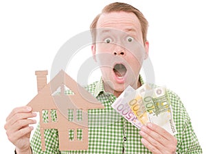 Shocked houseowner with money