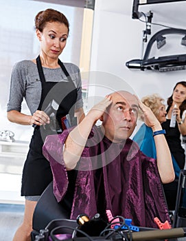 Shocked man in barber chair