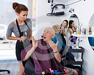 Shocked man in barber chair