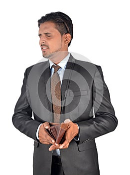 Shocked man with his empty leather wallet has no money isolated