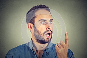 Shocked man looking at his finger