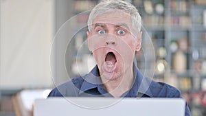 Shocked Man Showing Disbelief at Work