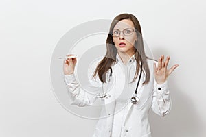 Shocked sad upset young doctor woman in medical gown with stethoscope, glasses, clinical thermometer with high fever