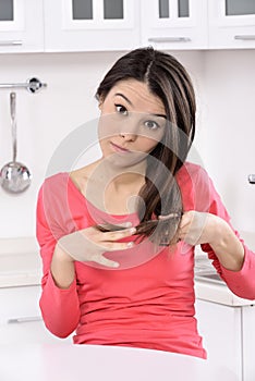 Shocked and sad woman - broken hair after coloration. photo