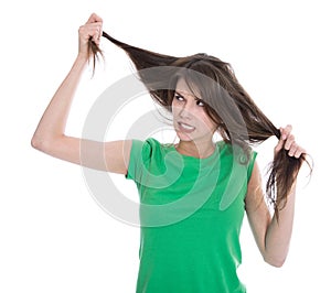 Shocked and sad woman - broken hair after coloration. photo